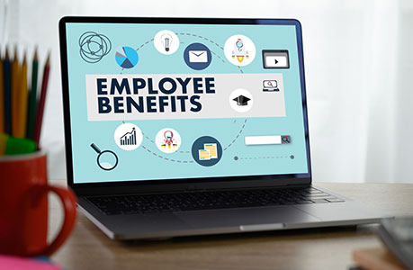 image of a laptop with the words - Employee Benefits